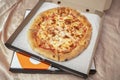 Pizza in an open delivery box. Home delivery