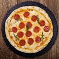 Pizza peperoni on stone black try Royalty Free Stock Photo