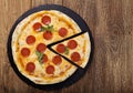 Pizza peperoni on stone black try Royalty Free Stock Photo