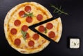 Pizza peperoni on stone black try Royalty Free Stock Photo