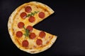 Pizza peperoni on stone black try Royalty Free Stock Photo