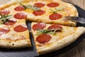 Pizza peperoni on stone black try Royalty Free Stock Photo