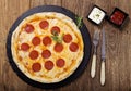 Pizza peperoni on stone black try with rocket and mozzarella cheese Royalty Free Stock Photo