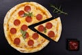 Pizza peperoni on stone black try with rocket and mozzarella cheese Royalty Free Stock Photo