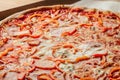 Pizza with pepper. big pepperoni pizza. tasty pizza with melting cheese tomatoes ham paprika. Food recipe background. Close up