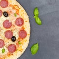Pizza pepperoni salami from above copyspace copy space square close up on a slate