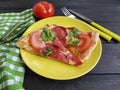 Pizza piece with sausage fork knife italian eat on a black woodeneatsalami Royalty Free Stock Photo