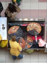 Pizza pieces vendor seen from above. Fast food and fast life.