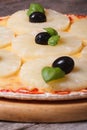 Pizza with pineapple on old table. closeup. Vertical Royalty Free Stock Photo