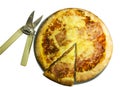 Pizza on a plate with a slice and scissors, top view Royalty Free Stock Photo