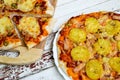 Pizza with potatoes and bacon and pizza with cheese
