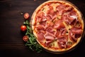 Pizza with prosciutto (parma ham) on dark wooden background