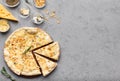 Pizza quattro fromaggi cutted into slices, top view Royalty Free Stock Photo