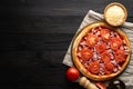 pizza ready for the oven on a wooden background, place for text Royalty Free Stock Photo