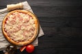 pizza ready for the oven on a wooden background, place for text Royalty Free Stock Photo