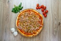 Pizza with red sauce, pulled porc, green olives top