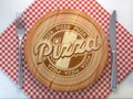 Pizza restaurant pizzaeria concept.Cutting wooden board with text pizza