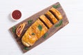 Pizza roll stromboli with cheese salami olives and tomatoes Royalty Free Stock Photo