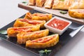 Pizza roll stromboli with cheese salami olives and tomatoes Royalty Free Stock Photo