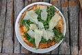 Pizza with rucola and parmigiano