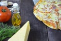 Pizza salami cheese ham. Hot Homemade Pepperoni Pizza Ready to Eat . with ingredients for cooking, greens, garlic, tomato, cheese Royalty Free Stock Photo