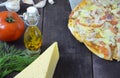 Pizza salami cheese ham. Hot Homemade Pepperoni Pizza Ready to Eat . with ingredients for cooking, greens, garlic, tomato, cheese Royalty Free Stock Photo