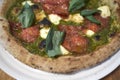 Pizza with salami and pesto Royalty Free Stock Photo