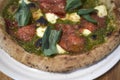 Pizza with salami and pesto Royalty Free Stock Photo