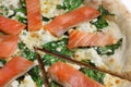Pizza with salmon close up one piece cut off Royalty Free Stock Photo