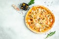 Pizza with salmon and mussels on a light background, Mediterranean cuisine, Restaurant menu, dieting, cookbook recipe top view