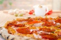 Pizza with sausage, bacon and pepperoni - close up Royalty Free Stock Photo