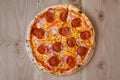 Pizza with sausage, bacon and pepperoni - Top view Royalty Free Stock Photo