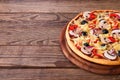 Pizza with seafood on wood table