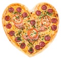 pizza in the shape of a heart with tomatoes, ham and salami sprinkling of fresh herbs on the Chroma key