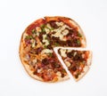 Pizza with slice isolated against white background Royalty Free Stock Photo