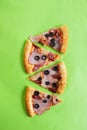 Pizza slices on a green background Royalty Free Stock Photo