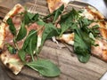 Pizza slices, Italian food on wooden plate.