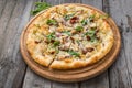 Pizza with sun-dried tomatoes, prosciutto, arugula and parmesan Royalty Free Stock Photo