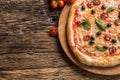 Pizza. Tasty fresh italian pizza served on old wooden table Royalty Free Stock Photo