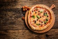 Pizza. Tasty fresh italian pizza served on old wooden table Royalty Free Stock Photo