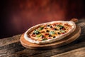 Pizza. Tasty fresh italian pizza served on old wooden table Royalty Free Stock Photo