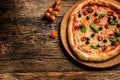 Pizza. Tasty fresh italian pizza served on old wooden table Royalty Free Stock Photo