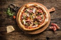 Pizza. Tasty fresh italian pizza served on old wooden table Royalty Free Stock Photo