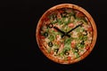 Pizza time in the form of a wall clock on a concrete background. Pizza clock. Place for text Royalty Free Stock Photo