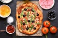 Pizza with tomato, salami and olives