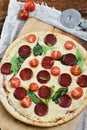 Tasty Pizza With Tomato Sauce, Pepperoni Sausage, And Mushrooms On Wooden Background Natural Rustic, A Pizza Cutter And Ingridient Royalty Free Stock Photo