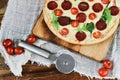 Tasty Pizza With Tomato Sauce, Pepperoni Sausage, And Mushrooms On Wooden Background Natural Rustic, A Pizza Cutter And Ingridient Royalty Free Stock Photo