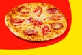 Pizza with tomatoes with cheese and salami Royalty Free Stock Photo