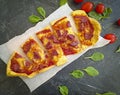 Pizza, tomatoes, sausage tomato mediterranean homemade dinner on concrete background