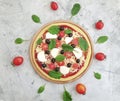 Pizza, tomatoes, olives mediterranean dinner traditional on concrete background preparation